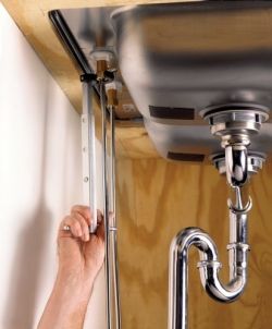Loosening downside nut with basin wrench